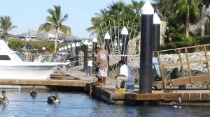 mexicans fishing on pier